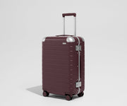 The Aluminum Edge Bigger Carry-On in Oxblood Red