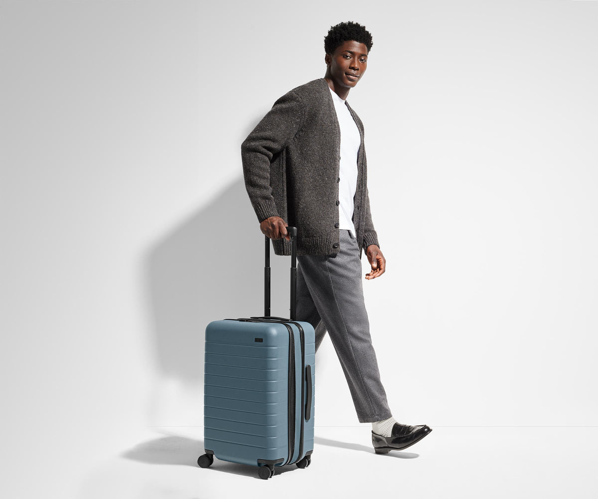 The Bigger Carry-On Flex in Navy Blue